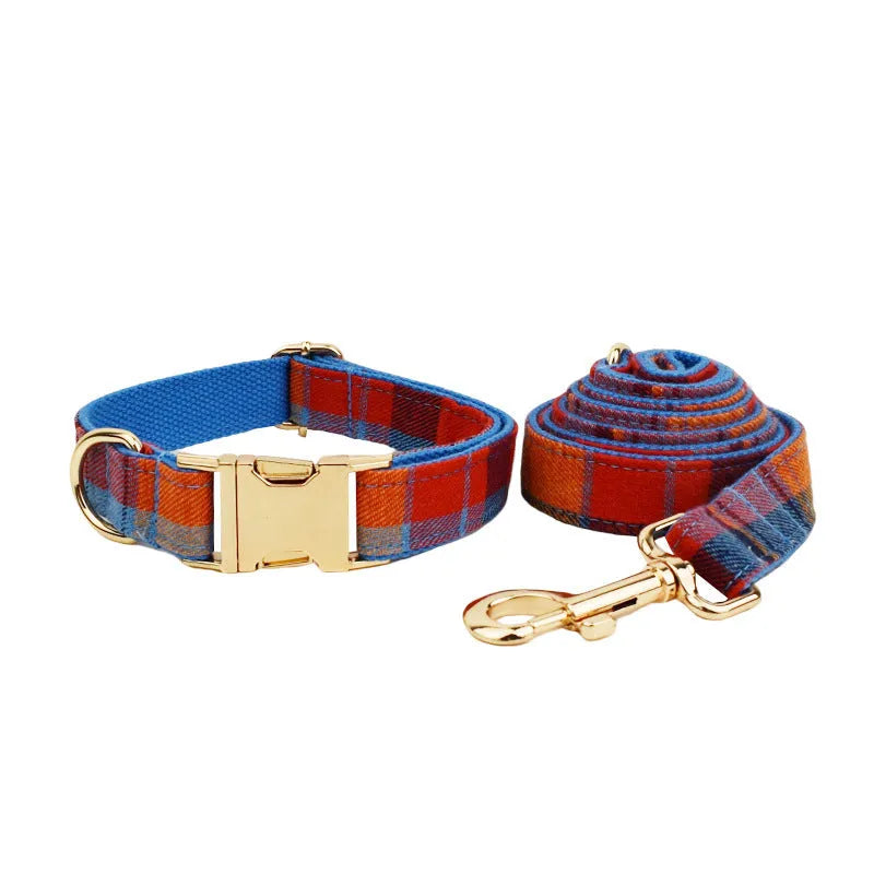 Blue velvet plaid dog collar with integrated hand-holding rope and leash set on cloth material