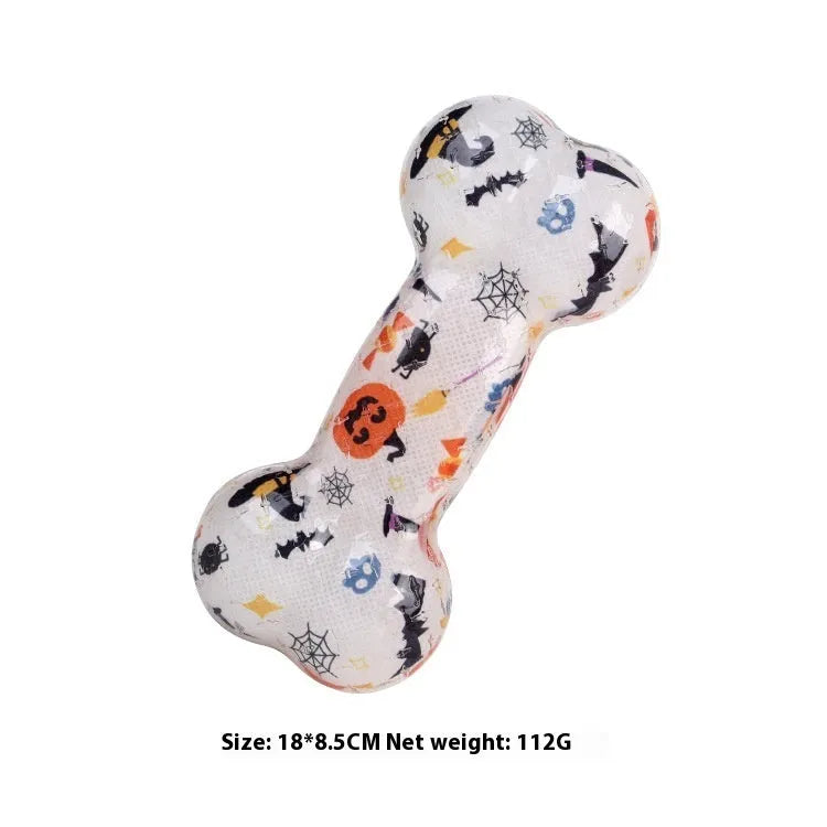 TPR bone-shaped chew toy with printed details in seasonal colours, produces nibbling sound when chewed