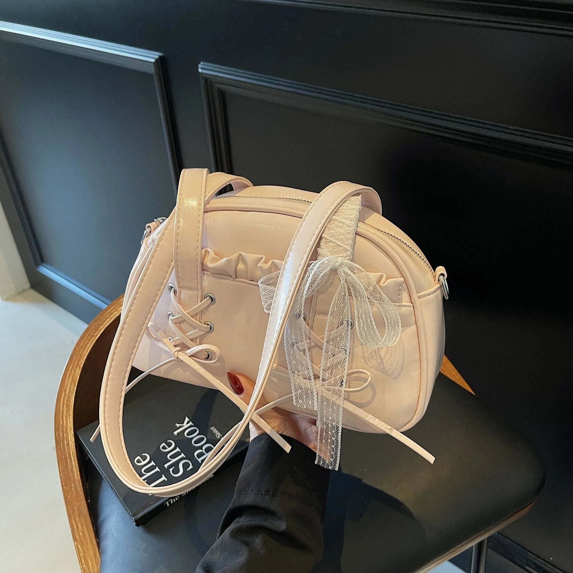 Women's casual PU shoulder handbag with bandage bow design in milky white colour showing sewing thread details