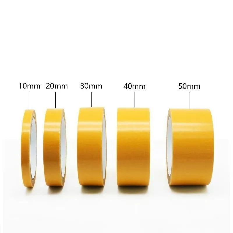 Roll of yellow grid double-sided cloth tape 5cm wide 20m long on white background