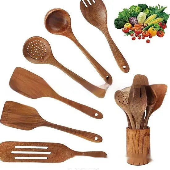 7-piece wooden kitchen utensil set with spoons and spatula on a table.