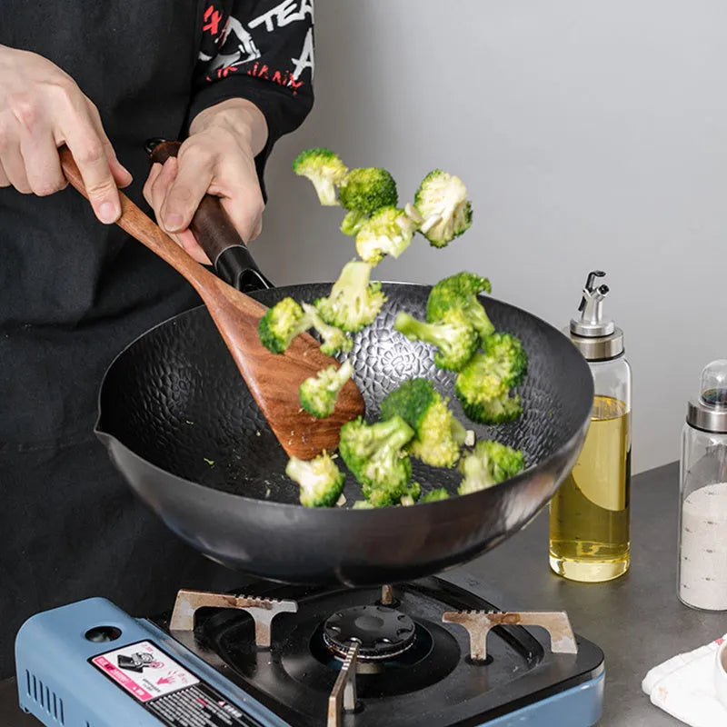 Traditional black iron wok with wooden handle measuring 40cm diameter