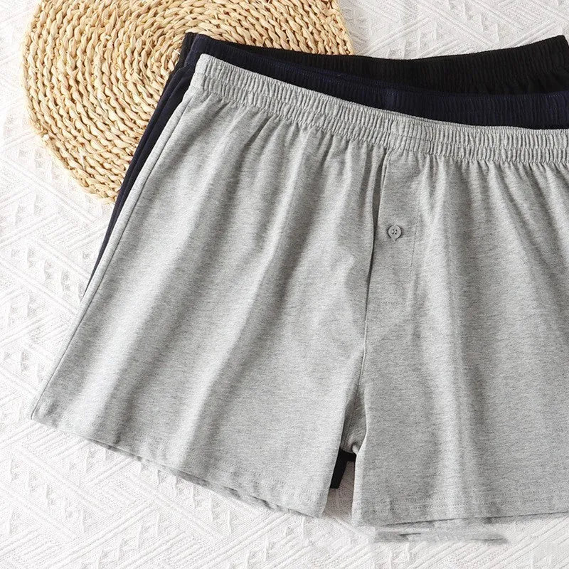 Men's pure cotton boxer shorts in black, light grey and navy blue colours showing high-waist loose fit design