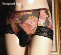 Men's black mesh nylon ice silk briefs with a mid-waist cut on a plain background.