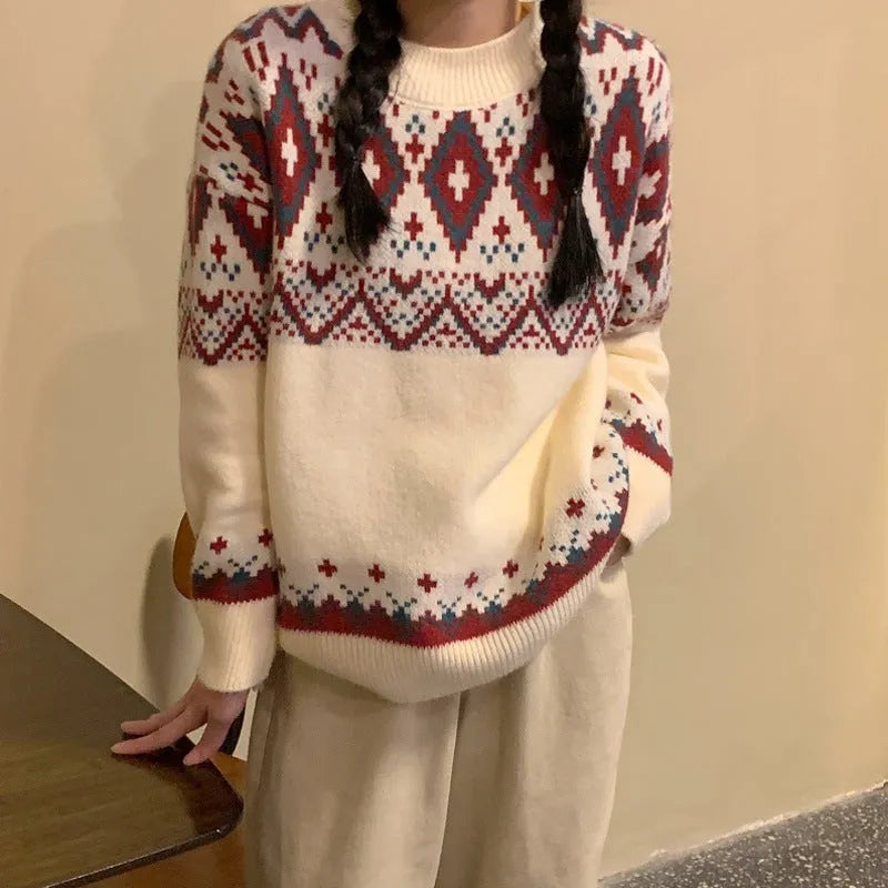 Red and white striped loose-fit knitted pullover with long sleeves on a model.
