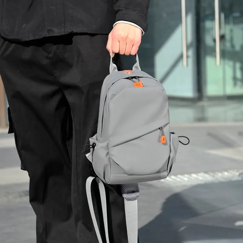 Men's black polyester crossbody bag with single shoulder strap and waterproof features