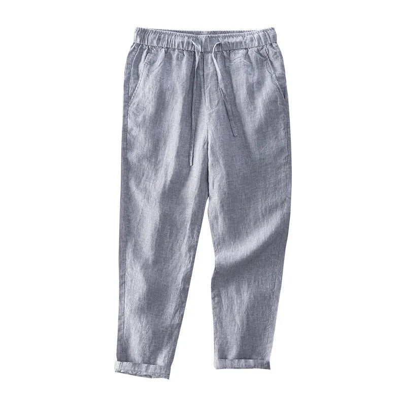 Men's straight-leg linen trousers in light grey colour showing mid-waist and straight-leg cut