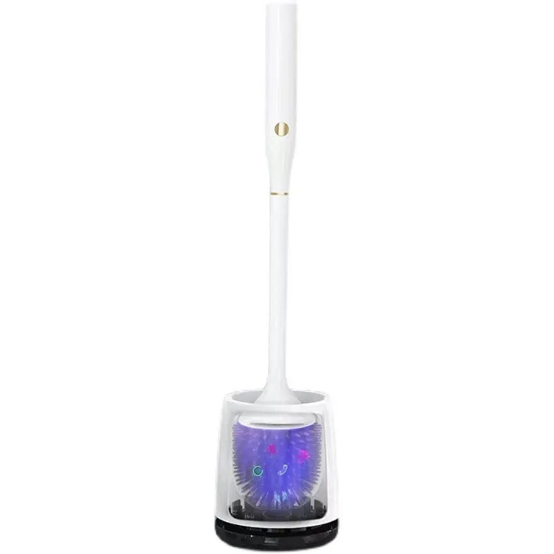White wireless electric toilet brush with base and USB cable on a bathroom floor