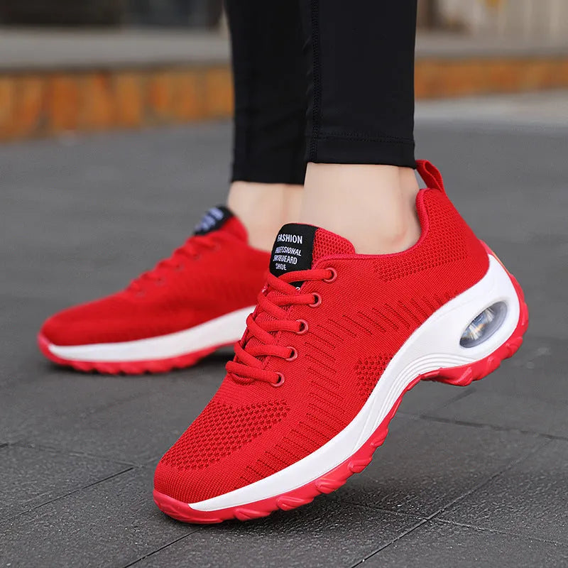 Women's red and black mesh lace-up sneakers with round toe and flat 3-5cm heel on a white background.