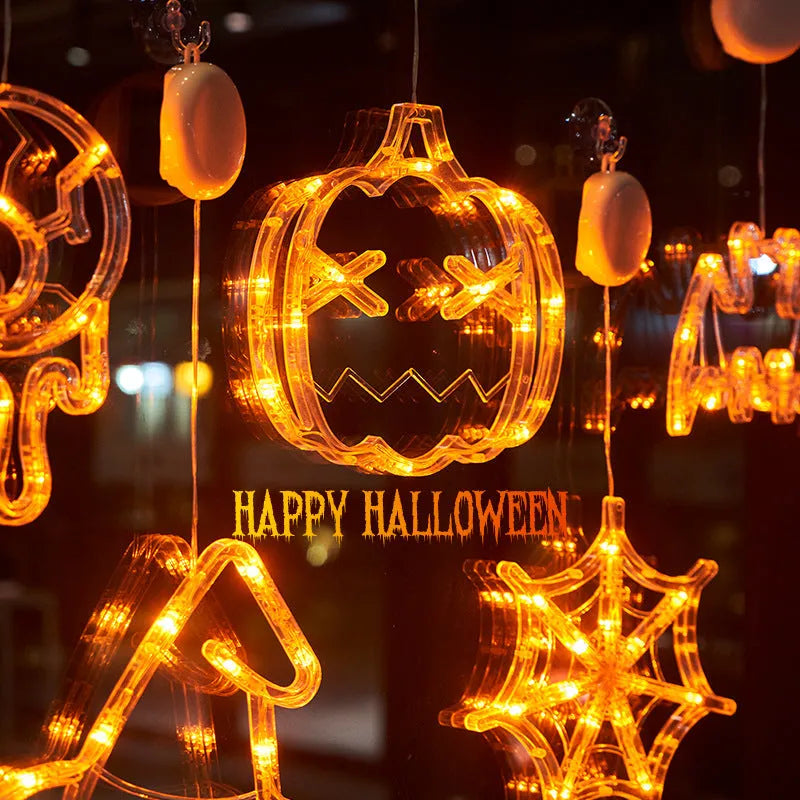 Seven Halloween LED hanging lights with spider, pumpkin and ghost designs featuring suction cups