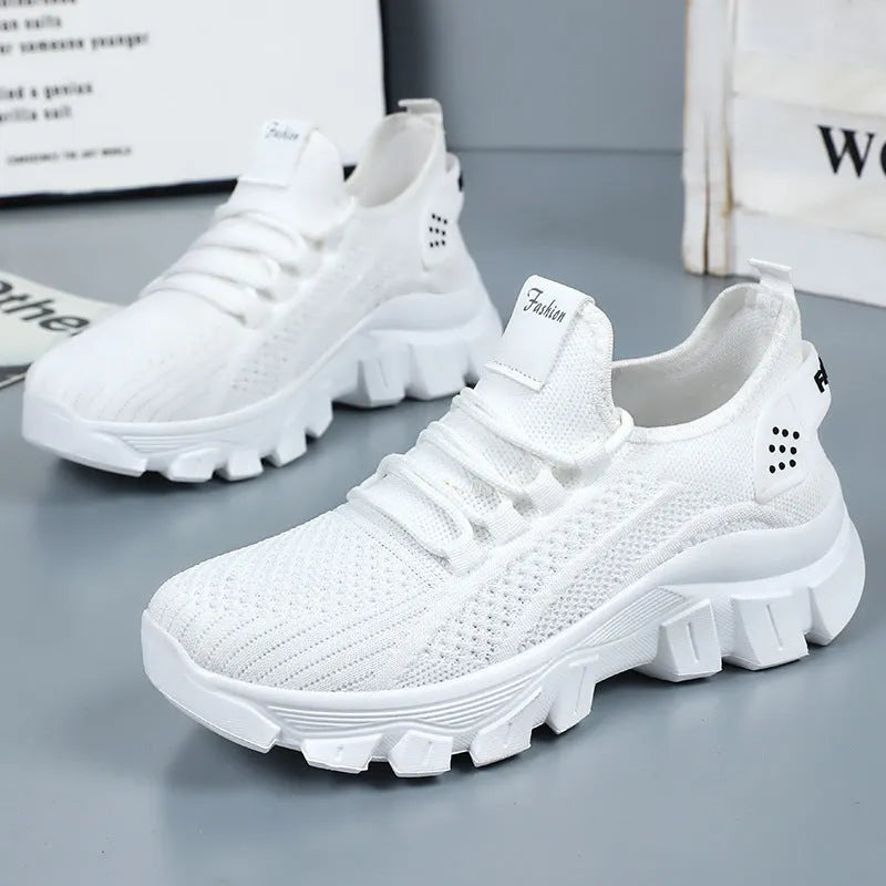Women's Flyknit sneakers with thick PVC sole in beige colour showing lace-up front and round toe design