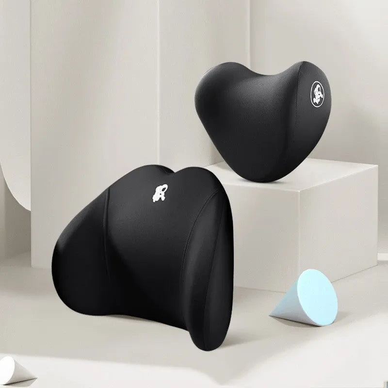 Heart-shaped car pillow in choice of colours, shown as headrest and lumbar support on a car seat.