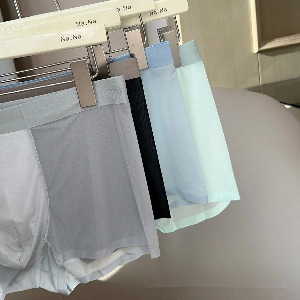 Ultra-thin ice silk men's boxer shorts with a seamless design and honeycomb crotch panel in a dark grey colour.