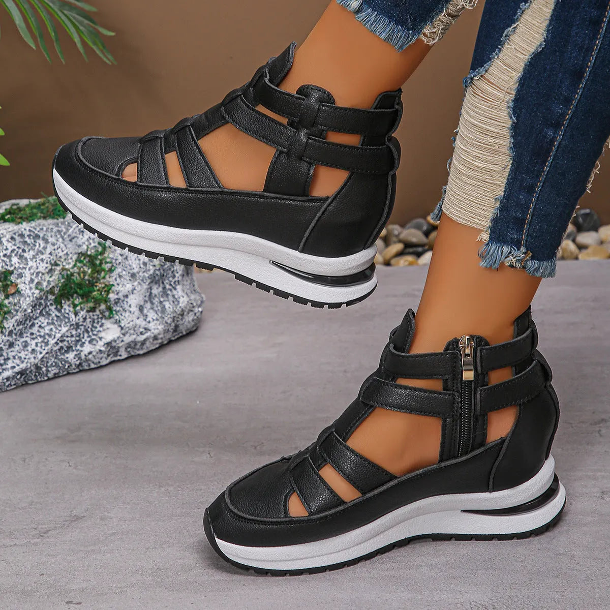 Black women's platform sandals with closed toe, hollow-out design and Velcro strap.