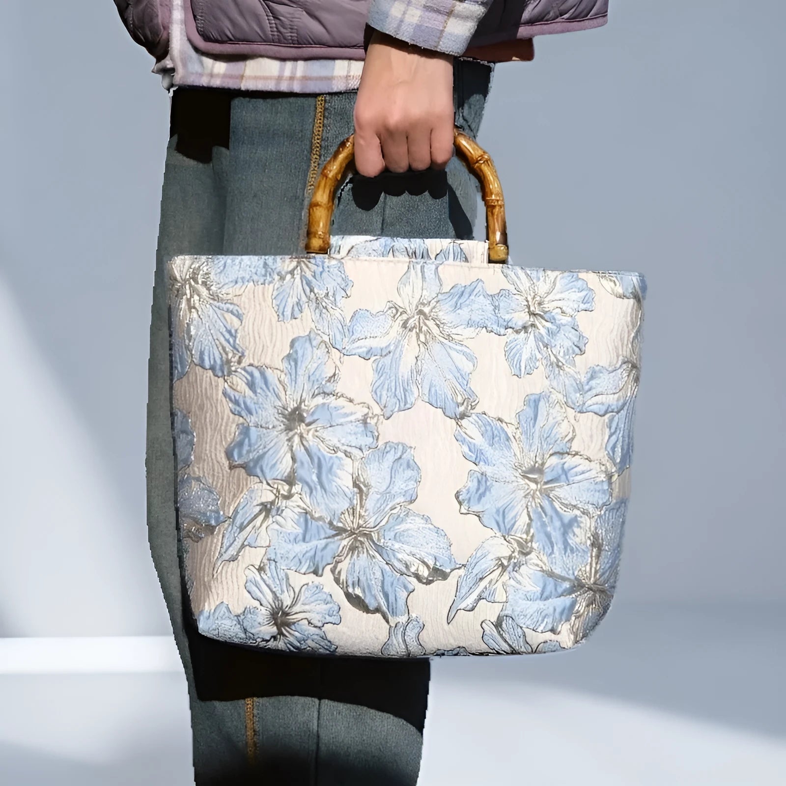 Light blue women's canvas bag with bronzing flower detail and double shoulder straps