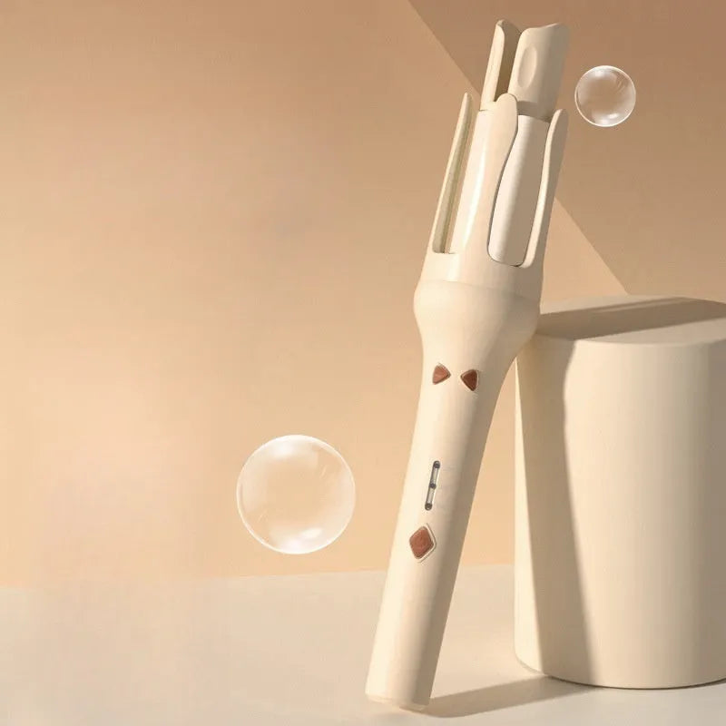 White and pink automatic hair curler with 32mm rotating barrel on a table