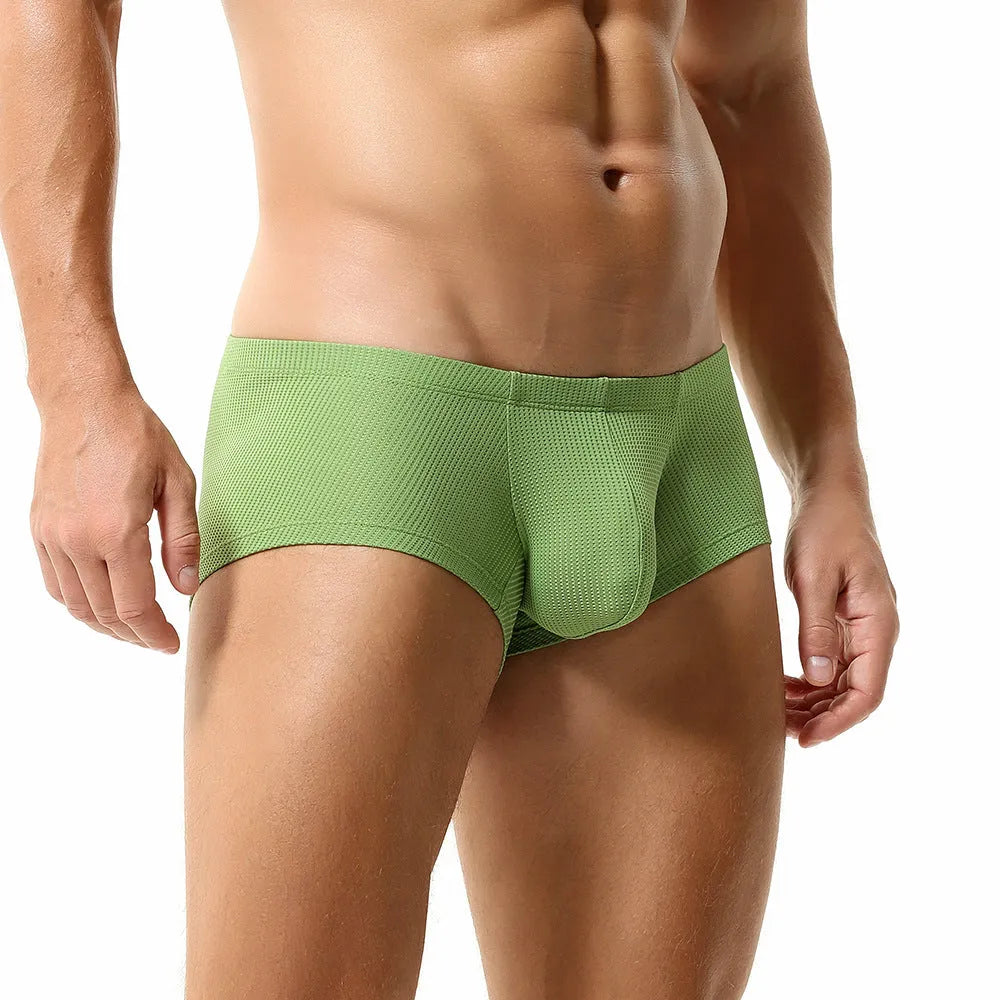 Men's low waist solid colour boxer shorts in breathable nylon fabric on a white background.