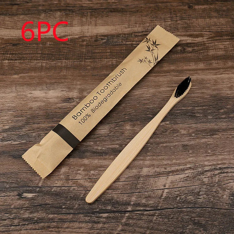 10 multi-coloured natural bamboo toothbrushes with soft charcoal bristles arranged on a white background