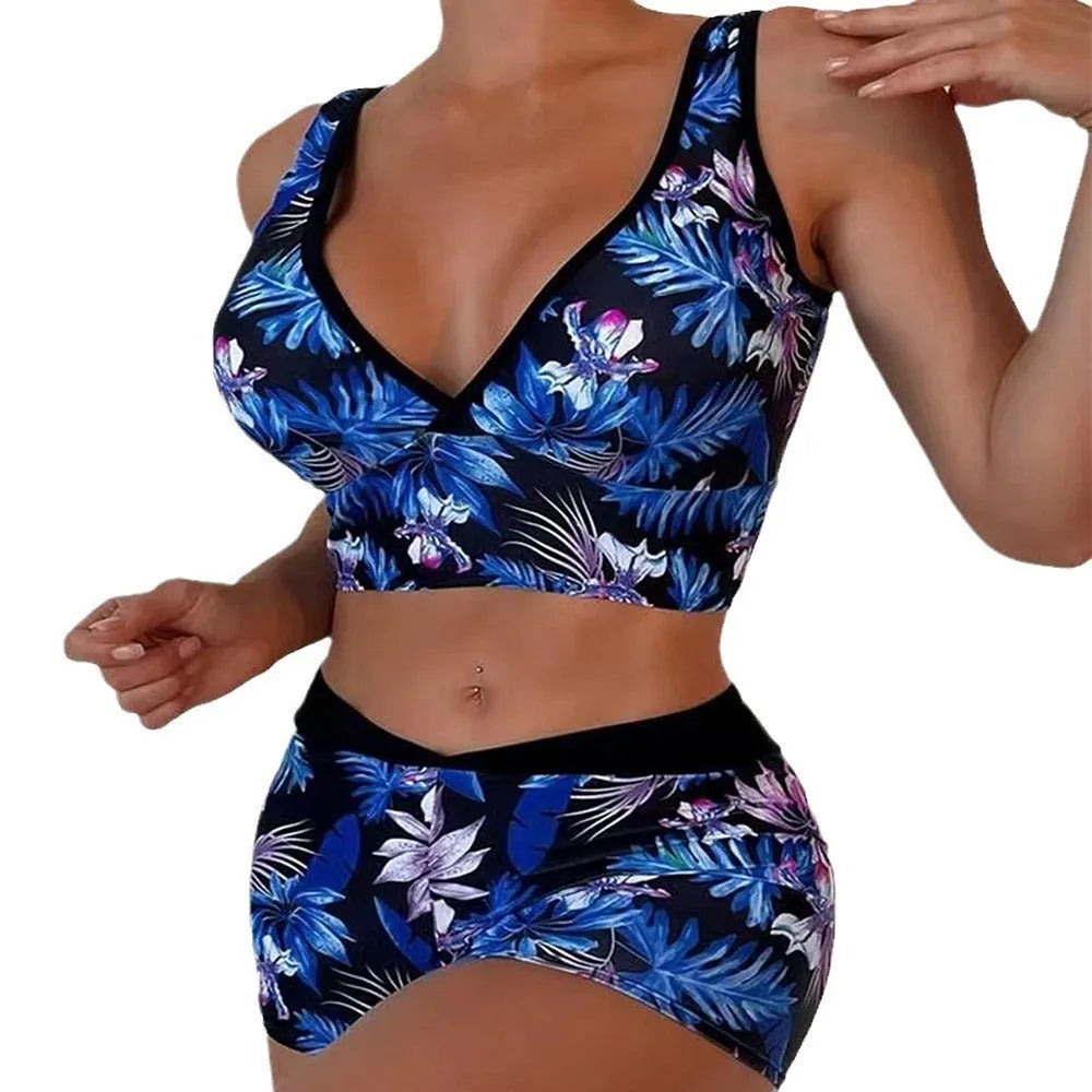 Women's two-piece printed swimsuit with sleeveless top and briefs-style bottoms in a multi-colour design.