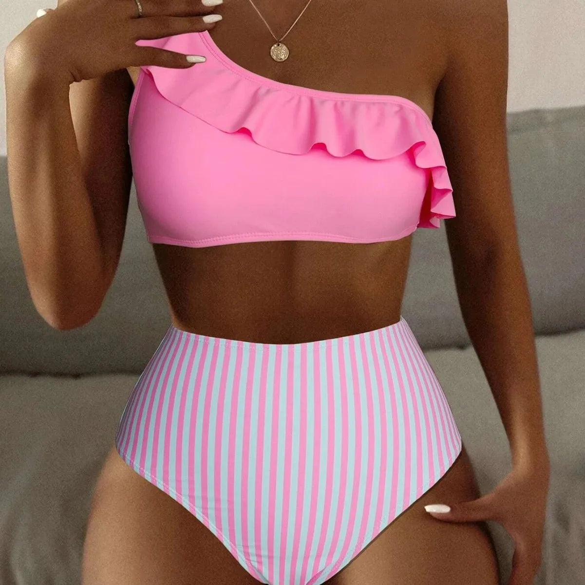 Women's striped and solid colour split design bikini swimsuit shown in multiple colour options.