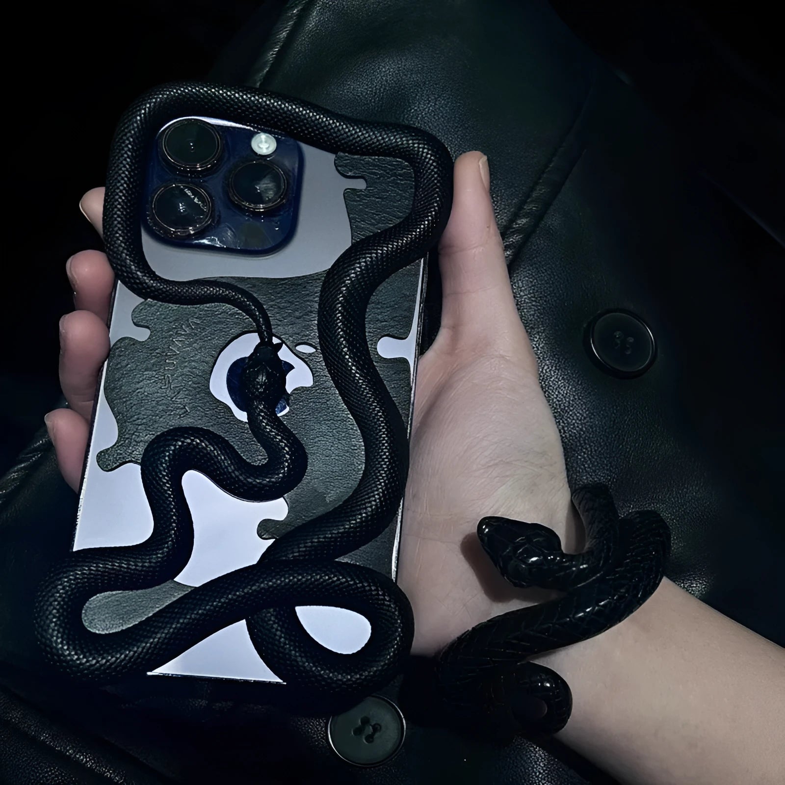 Tailed snake hollowed-out decorative phone case in black stone pattern for iPhone