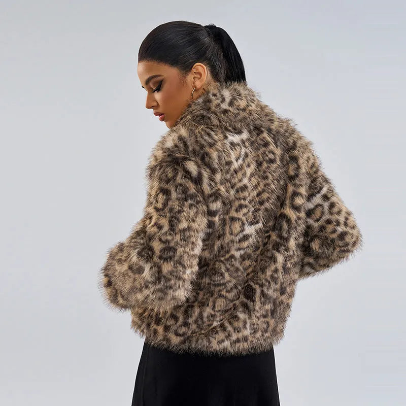 Women's leopard print polyester coat with a buckle lapel closure on a hanger.