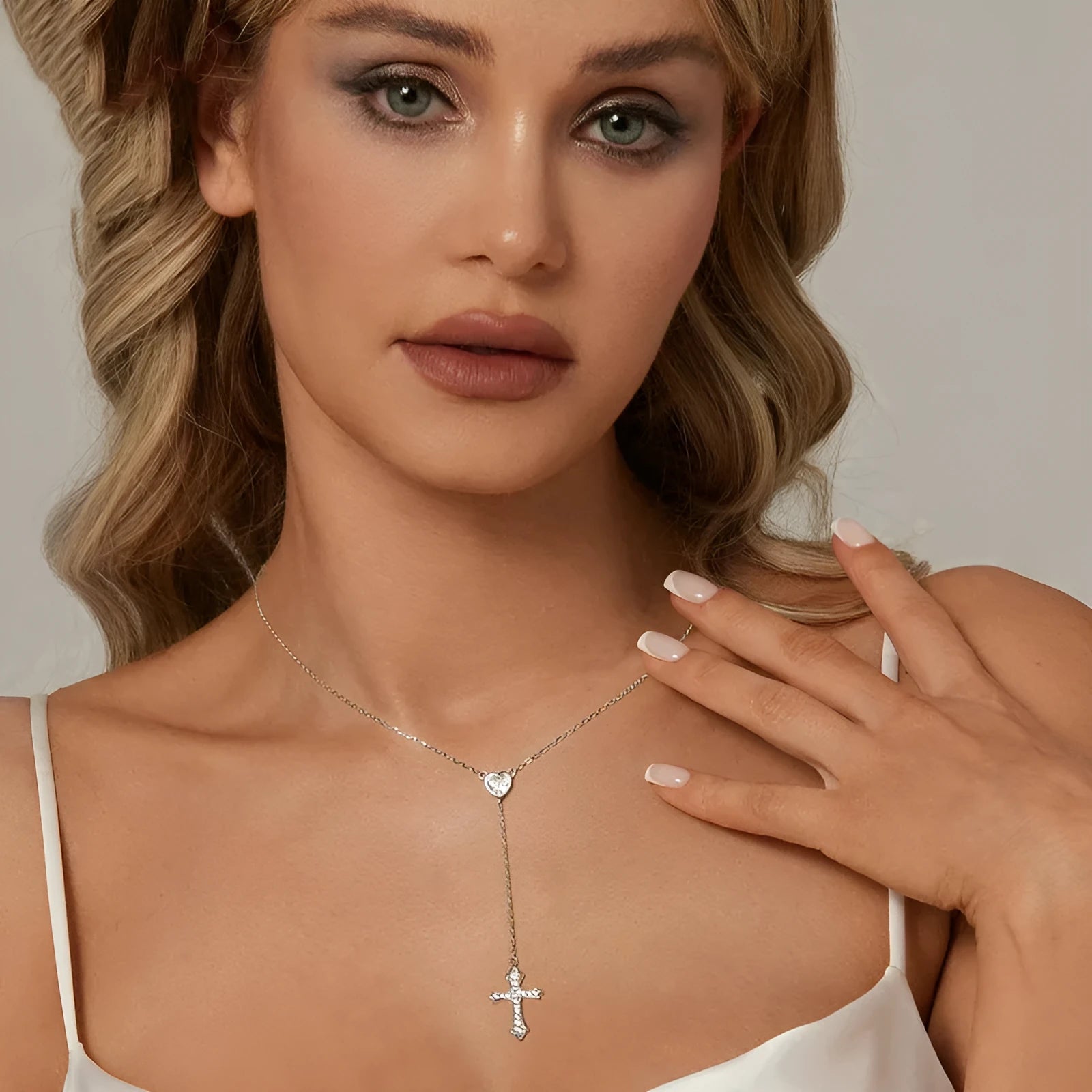 Silver cross necklace with O-ring chain in BSN384 colour, showing V-neck design