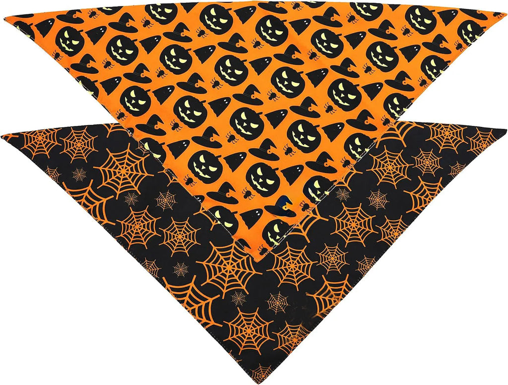 Black and orange reversible Halloween dog bandana with pumpkin and spider web patterns, showing adjustable neck strap