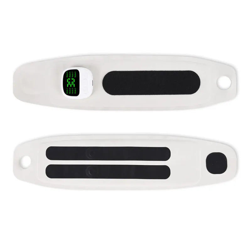 Adjustable wireless hand massage instrument with coloured Lycra wristbands on a table.