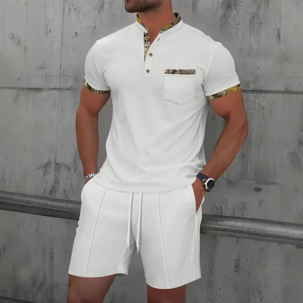 Man wearing a grey waffle texture short sleeve zip-up jacket and matching shorts from the suit set.