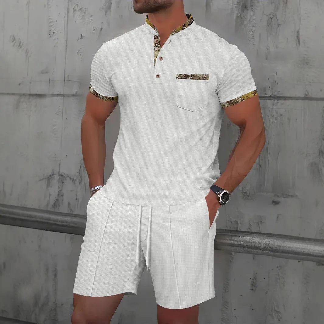 Man wearing a grey waffle texture short sleeve zip-up jacket and matching shorts from the suit set.