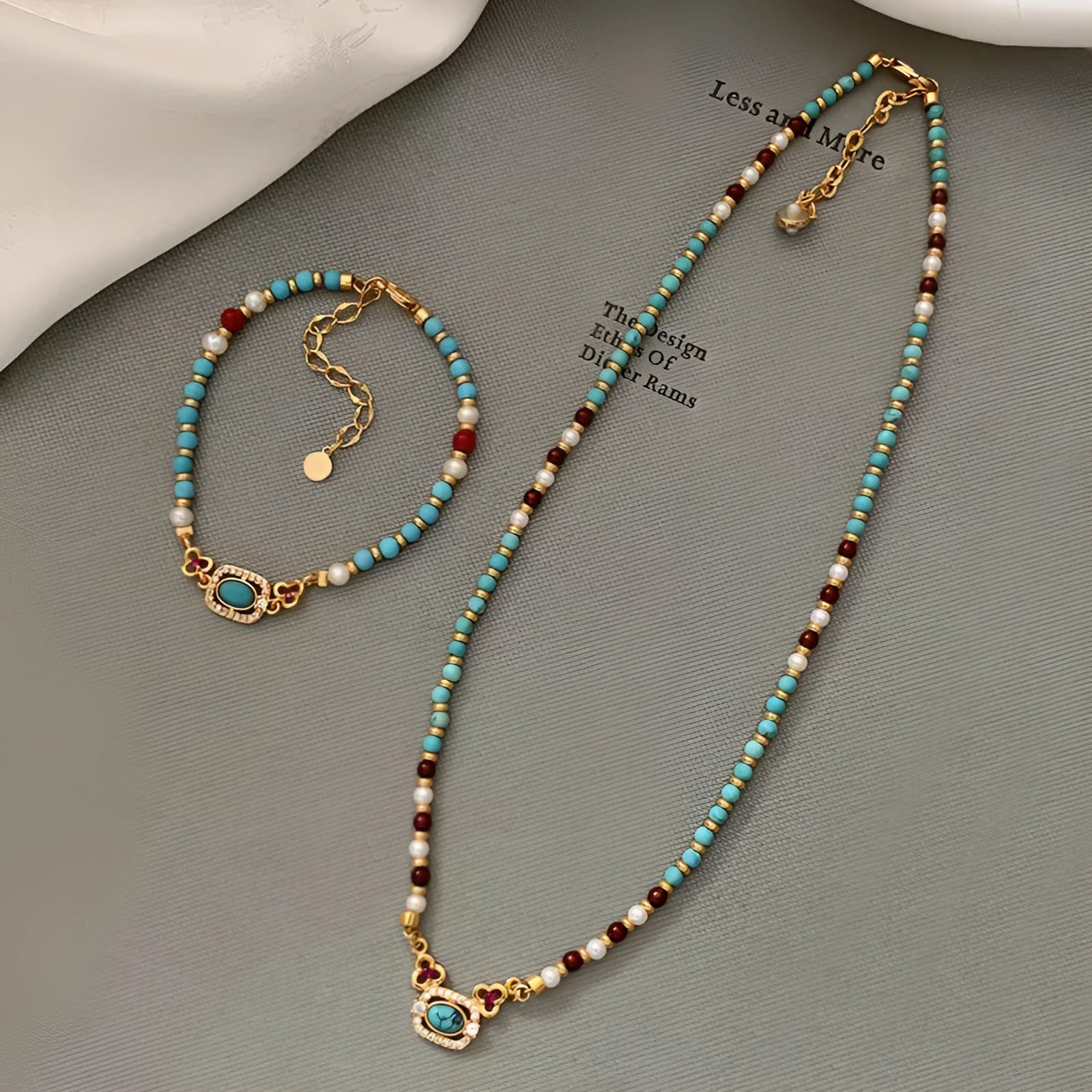 Natural turquoise pearl necklace with gold plated copper chain and matching bracelet on display