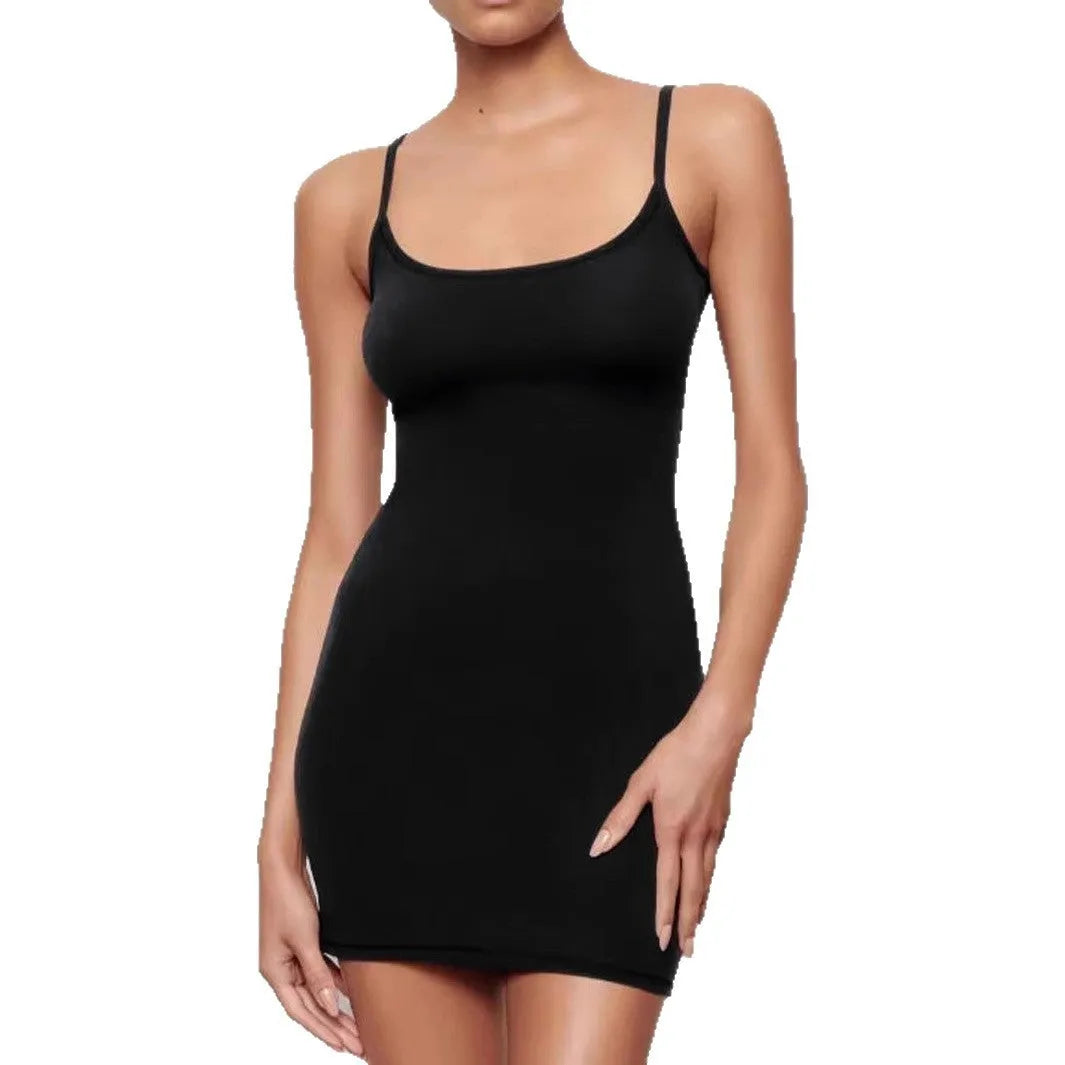 A black sleeveless sling dress with a slim sheath silhouette and short hemline on a hanger.