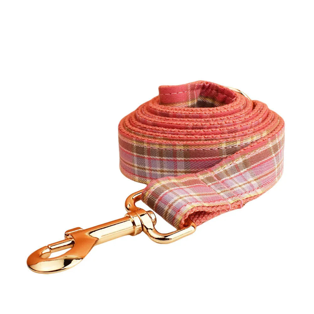 Plaid dog collar and matching leash set with decorative bow and vest for special occasions
