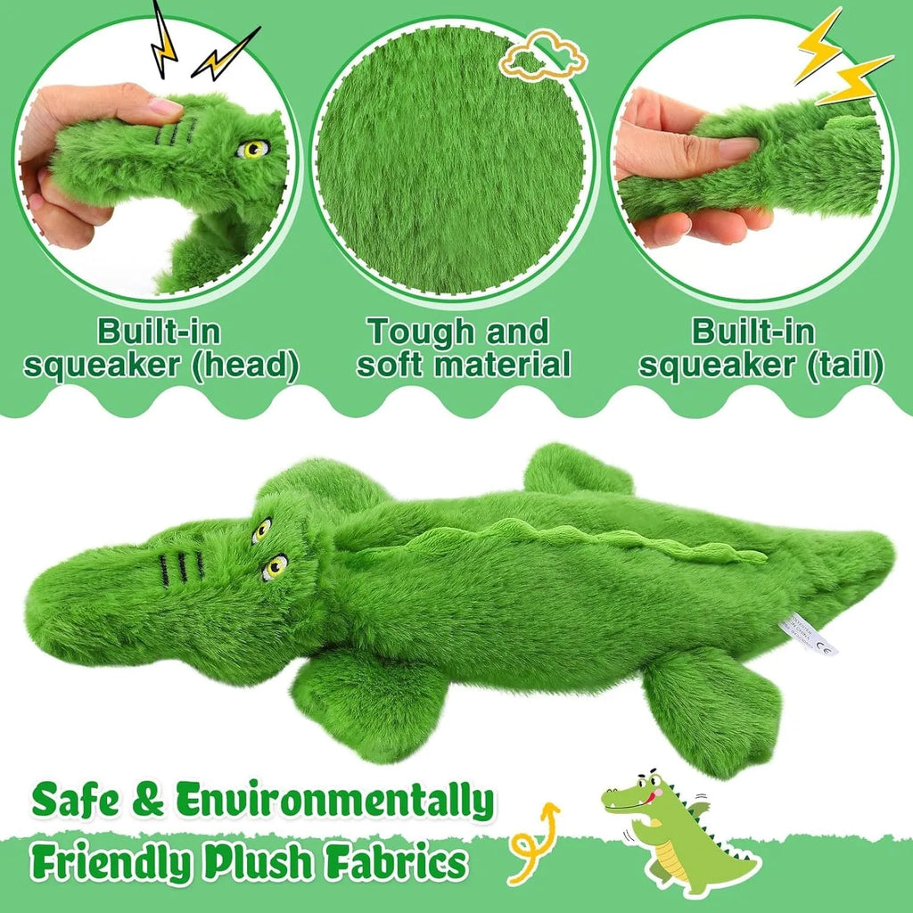 Green crocodile-shaped dog toy with squeaker in head and crinkle paper in tail