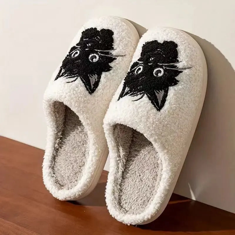 White plush slippers with a Black Beard Cat cartoon design on the toe.