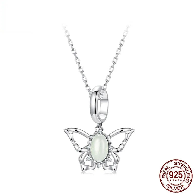 925 sterling silver butterfly pendant with green natural jade inlay on a white background