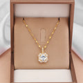Gold geometric quadrilateral pendant necklace with gem inlay on a water wave chain.