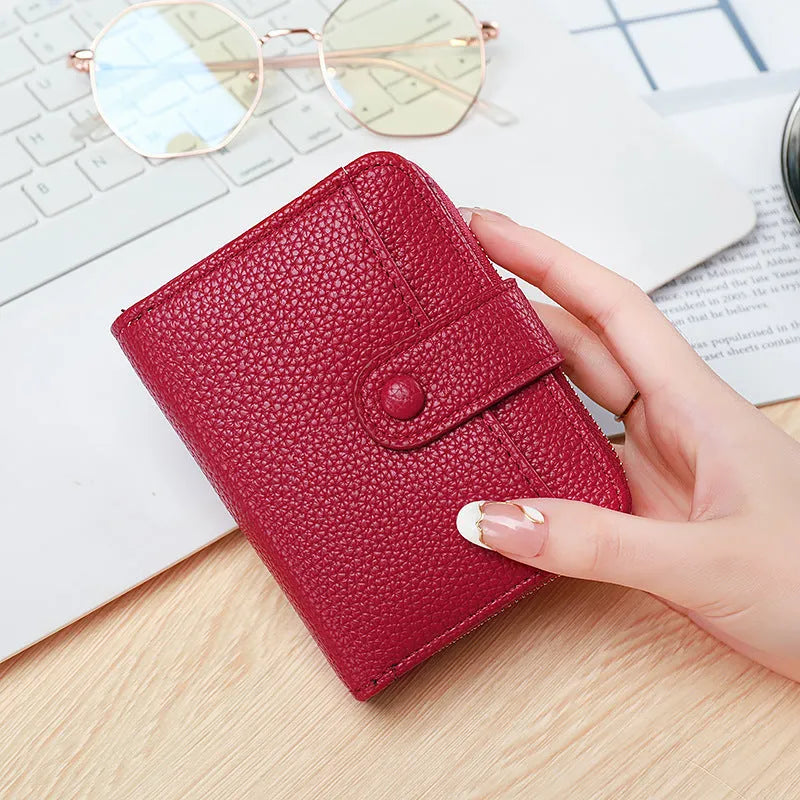 Women's lychee pattern short wallet in PU leather with antibacterial lining shown in beige, pink, black, and red colour options