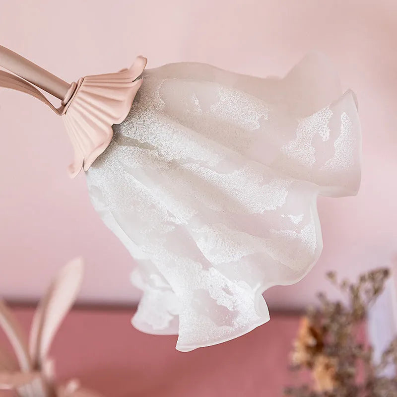 Pink princess room desk lamp with ceramic flowers, glass lampshade, and dimmer switch on a wooden desk