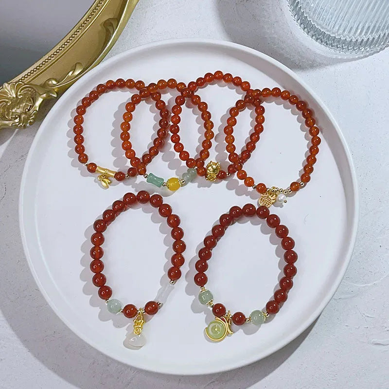 Handmade red agate bracelet with dragon design for women, Chinese style.
