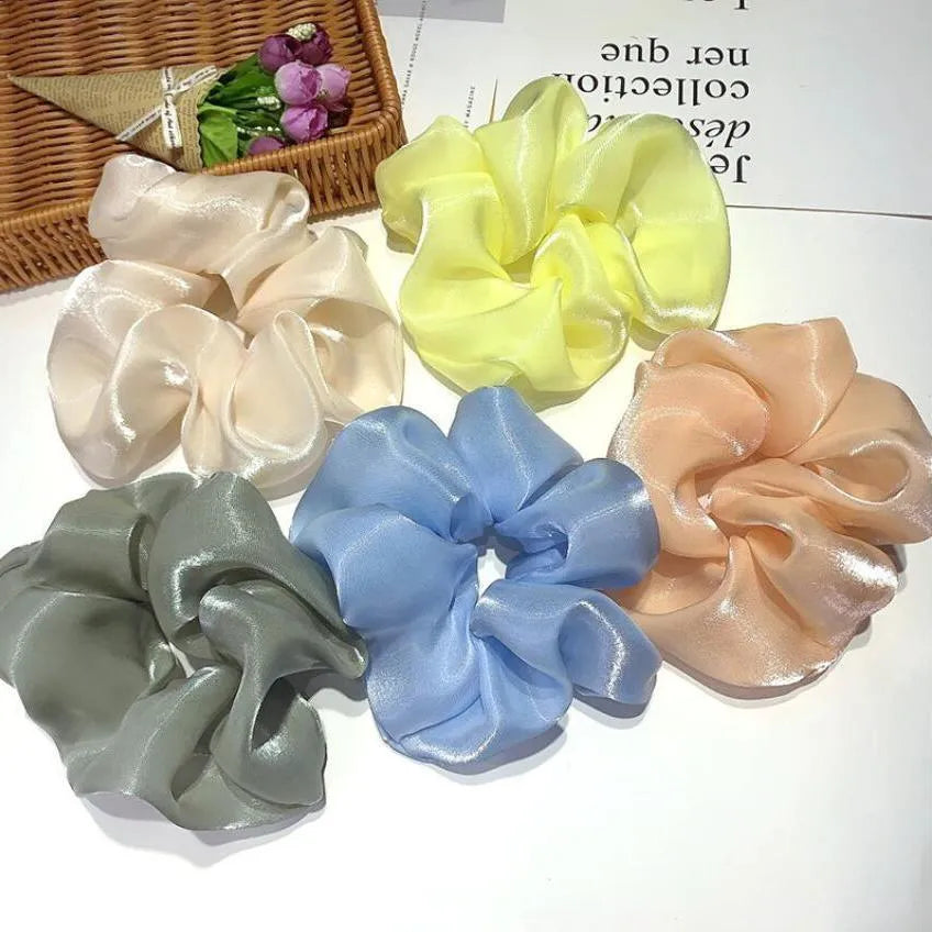 Korean style cloth hair ring with crystal satin finish in light pink colour on a white background