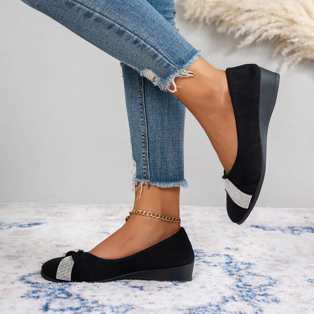 Black women's slip-on casual shoes with round toe, rhinestone detail, and a short chunky heel.