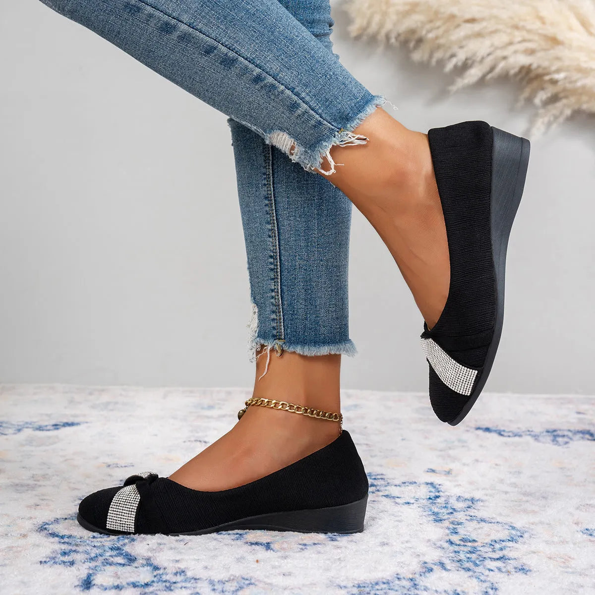 Black women's slip-on casual shoes with round toe, rhinestone detail, and a short chunky heel.
