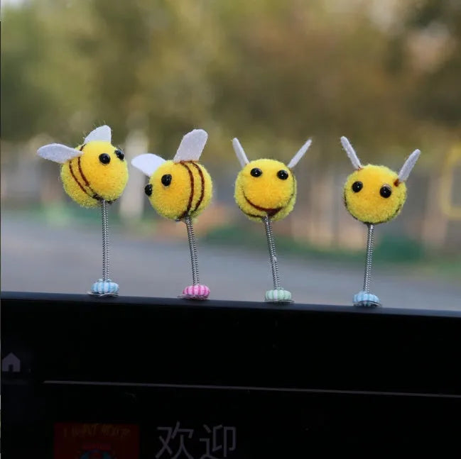 Soft fur ball Swing Spring Bee car decoration ornament measuring 3 by 3 centimetres.