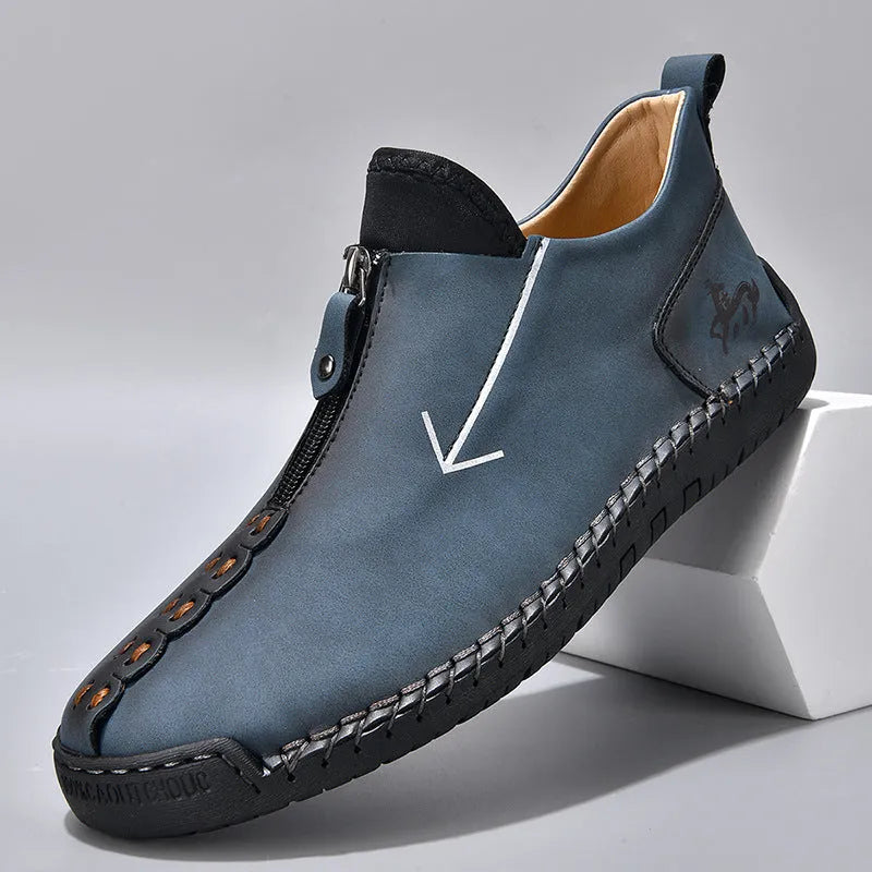 Men's black casual leather boots with a front side zipper and a hand-stitched rubber sole.