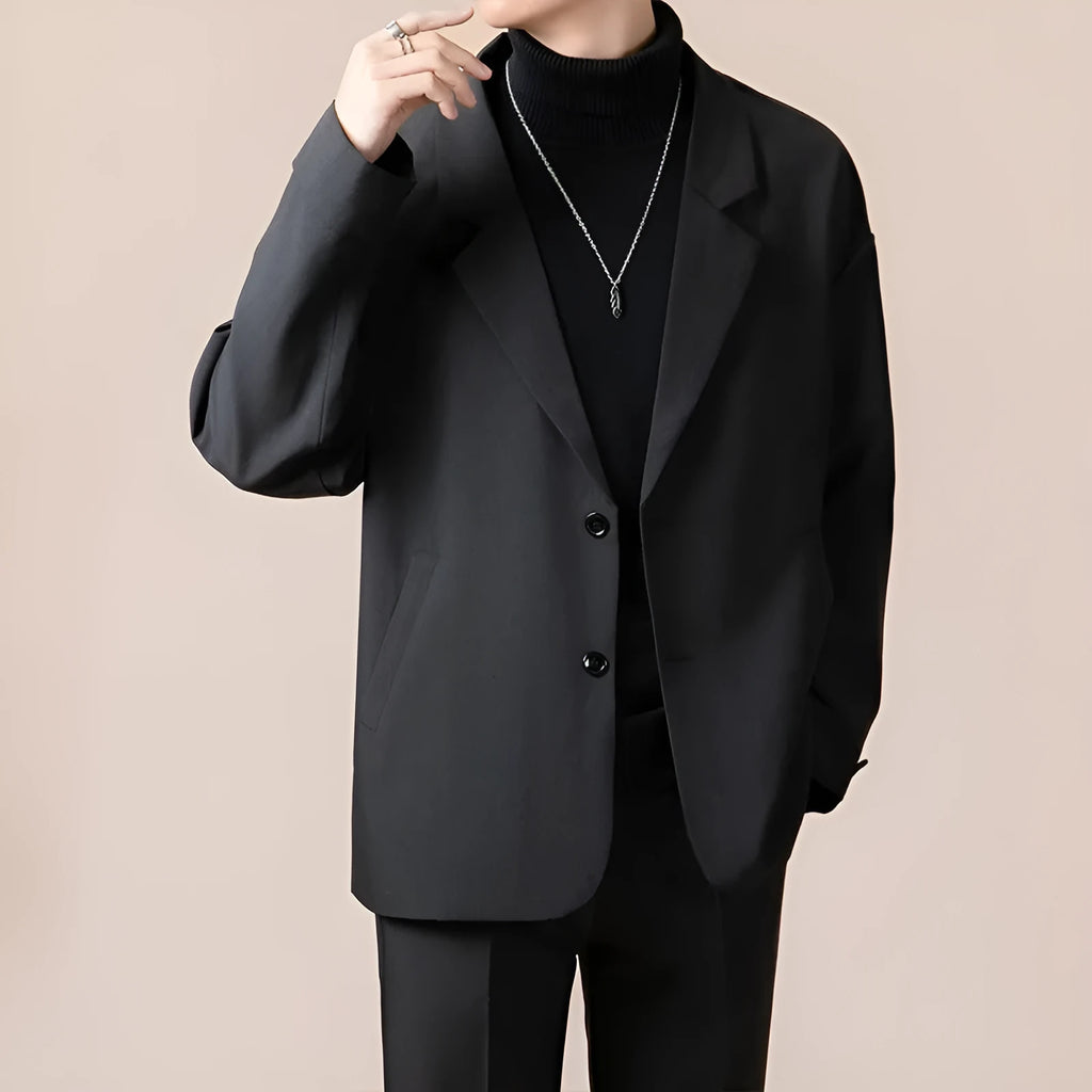 Man wearing a loose fit apricot coloured blazer jacket for light business or casual wear.