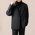 Man wearing a loose fit apricot coloured blazer jacket for light business or casual wear.