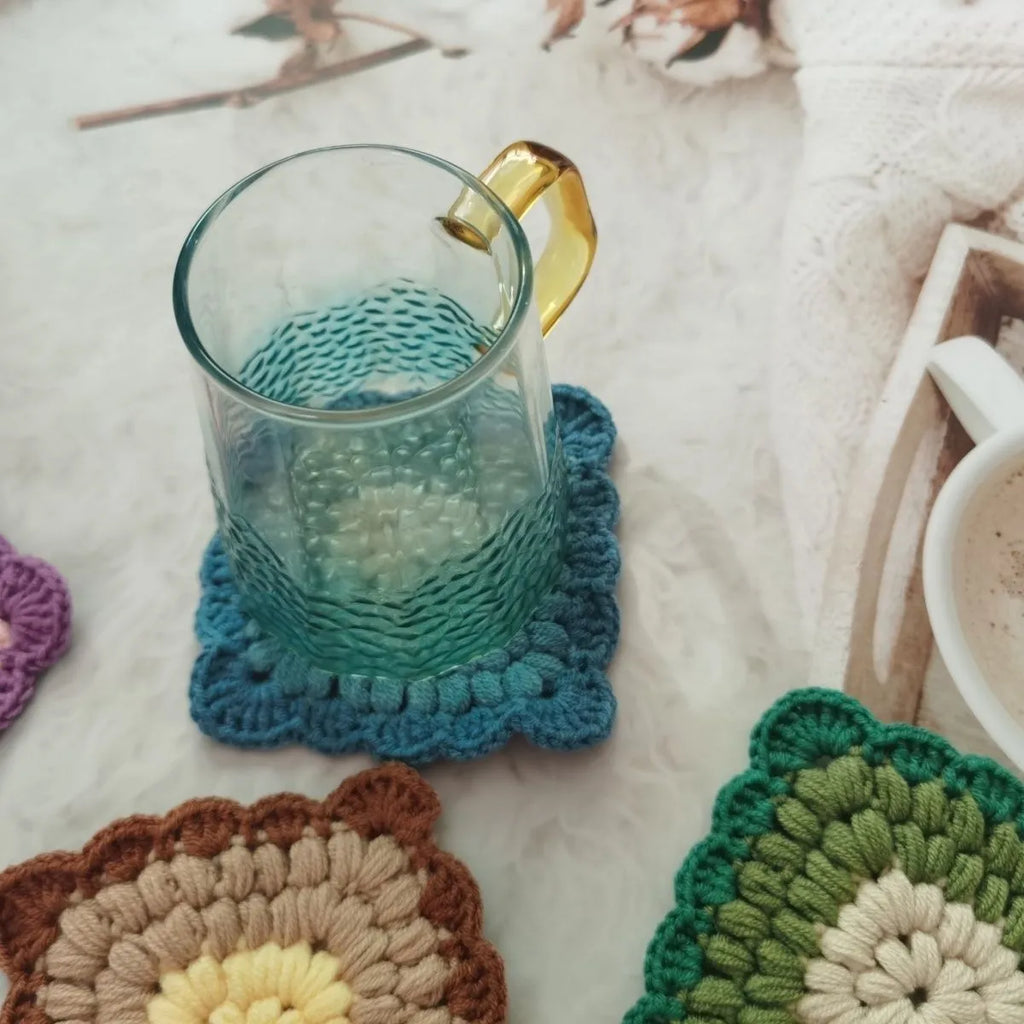 Crocheted grandmother lattice wool cup placemat coaster in emerald, sea salt blue, dream purple or fog brown.