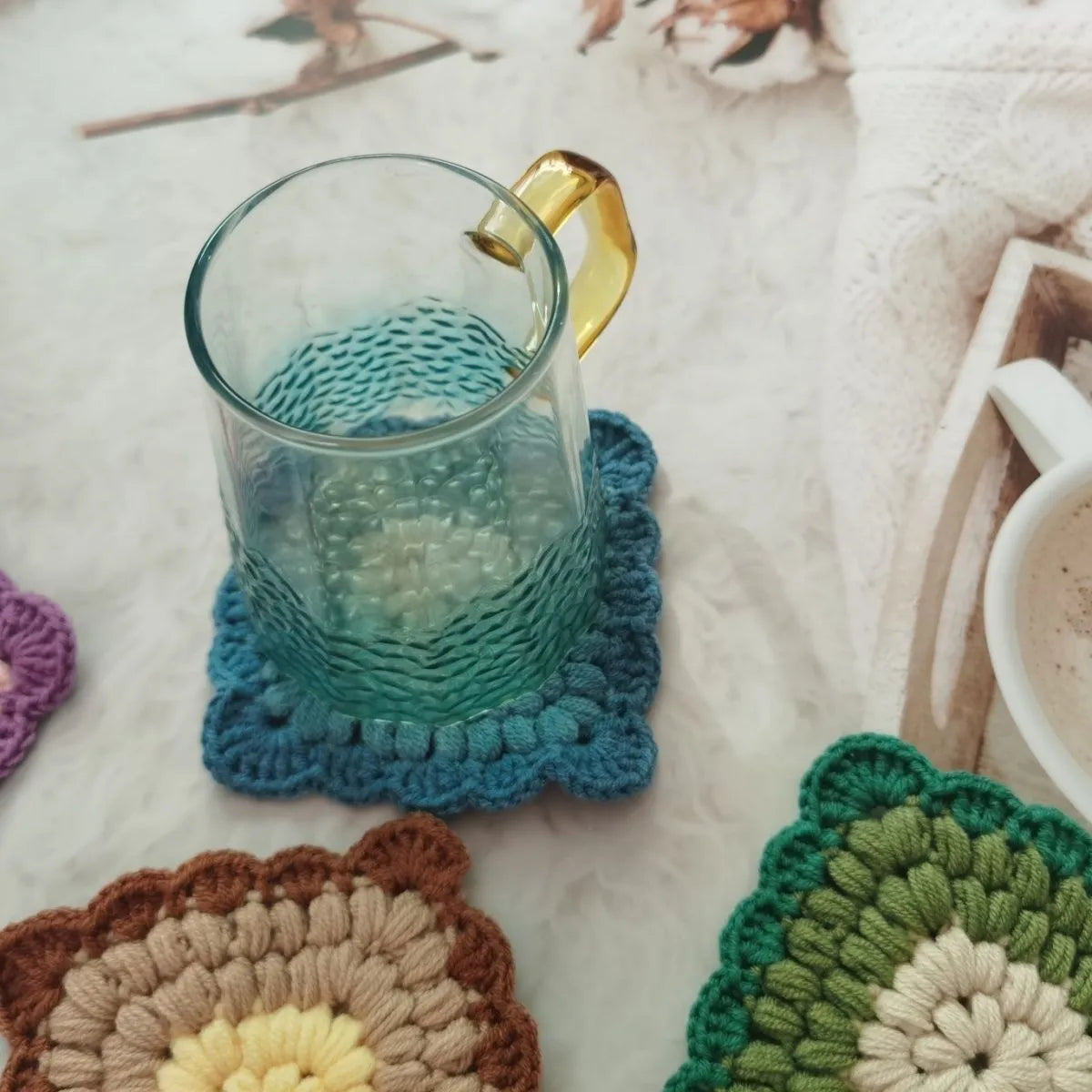 Crocheted grandmother lattice wool cup placemat coaster in emerald, sea salt blue, dream purple or fog brown.